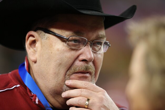 Jan 04, 2013; Arlington, TX, USA; WWE announcer and Oklahoma Sooners fan Jim Ross on the sidelines during the game against the Texas A&M Aggies in the 2013 Cotton Bowl at Cowboys Stadium. Mandatory Credit: Kevin Jairaj-USA TODAY Sports
