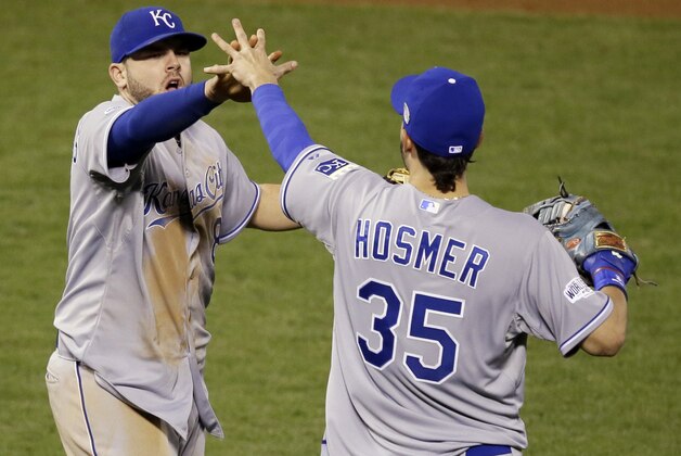 Kansas City Royals' Mike Moustakas and Eric Hosmer (35) celebrate after Game 3 of baseball's World Series against the San Francisco Giants Friday, Oct. 24, 2014, in San Francisco. The Royals won 3-2 to take a 2-1 lead in the series. (AP Photo/Eric Risberg)