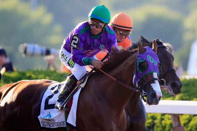 ELMONT, NY - JUNE 07:  California Chrome #2, ridden by Victor Espinoza, breaks from the gate during the 146th running of the Belmont Stakes at Belmont Park on June 7, 2014 in Elmont, New York.  (Photo by Rob Carr/Getty Images)