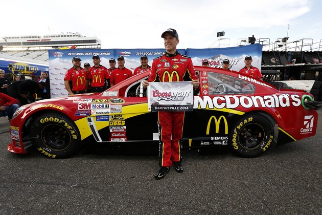 MARTINSVILLE, VA - OCTOBER 24:  Jamie McMurray, driver of the #1 McDonald's Chevrolet, poses with the Coors Light Pole Award after qualifying for the pole for the NASCAR Sprint Cup Series Goody's Headache Relief Shot 500 at Martinsville Speedway on October 24, 2014 in Martinsville, Virginia.  (Photo by Jeff Zelevansky/Getty Images)