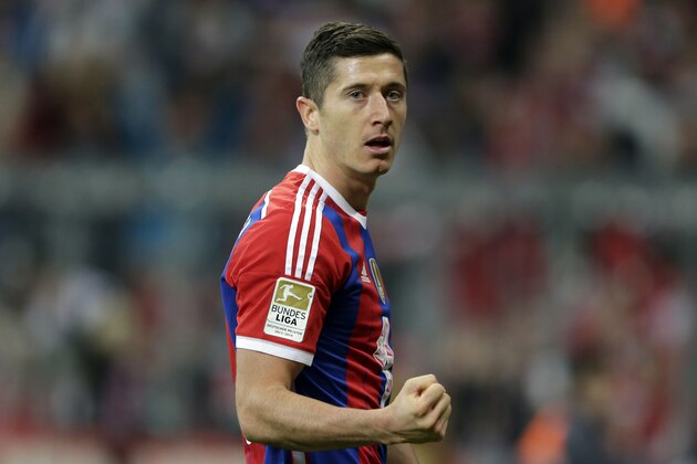 Bayern's Robert Lewandowski from Poland celebrates after scoring his side's second goal during the German first division Bundesliga soccer match between FC Bayern and SC Paderborn 07 in the Allianz Arena in Munich, Germany, on Tuesday, Sept. 23, 2014. (AP Photo/Matthias Schrader)