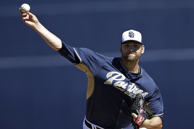 FILE - In this  March 8, 2014, file photo, San Diego Padres starting pitcher Josh Johnson throws before an exhibition spring training baseball game against the Cleveland Indians in Peoria, Ariz. San Diego Padres starter Johnson is scheduled to undergo elbow ligament-replacement surgery for the second time and will miss the entire season. (AP Photo/Darron Cummings, File)