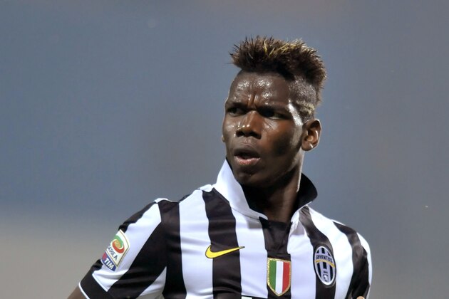 Juventus' Paul Pogba celebrates after scoring, during a Serie A soccer match against Sassuolo, at Reggio Emilia's Mapei stadium, Italy, Saturday, Oct. 18, 2014. (AP Photo/Marco Vasini)