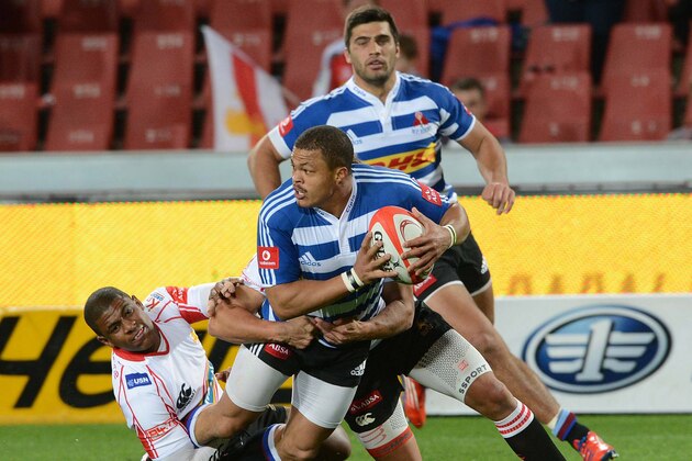 JOHANNESBURG, SOUTH AFRICA - AUGUST 30: Anthony Volmink of the Lions tackles Juan de Jongh of the WP during the Absa Currie Cup match between MTN Golden Lions and DHL Western Province at Ellis Park on August 30, 2013 in Johannesburg, South Africa. (Photo by Lee Warren/Gallo Images/Getty Images)