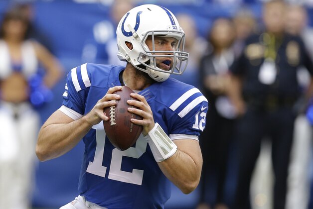 Indianapolis Colts quarterback Andrew Luck looks to pass during the first half of an NFL football game against the Cincinnati Bengals, Sunday, Oct. 19, 2014, in Indianapolis. (AP Photo/Michael Conroy)