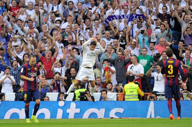 MADRID, SPAIN - OCTOBER 25:  Cristiano Ronaldo of Real Madrid CF celebrates after scoring his team's opening goal from the penalty spot during the La Liga match between Real Madrid CF and FC Barcelona at Estadio Santiago Bernabeu on October 25, 2014 in Madrid, Spain.  (Photo by Denis Doyle/Getty Images)