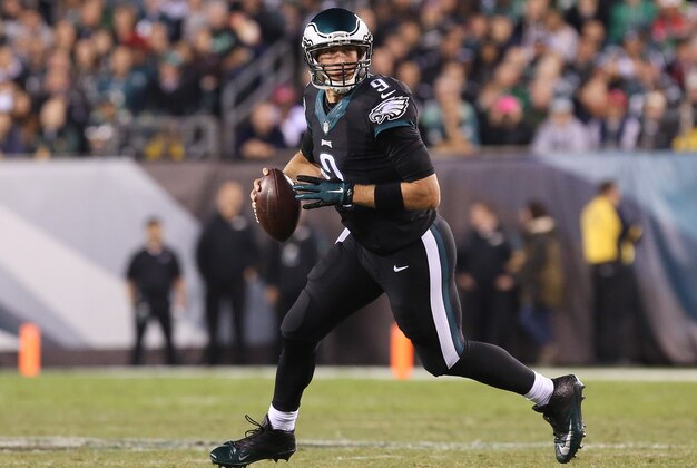 Oct 12, 2014; Philadelphia, PA, USA; Philadelphia Eagles quarterback Nick Foles (9) drops back to pas against the New York Giants at Lincoln Financial Field. The Eagles defeated the Giants 27-0. Mandatory Credit: Bill Streicher-USA TODAY Sports