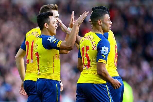 SUNDERLAND, ENGLAND - OCTOBER 25: Alexis Sanchez of Arsenal celebrates with teammates after scoring the opening goal during the Barclays Premier League match between Sunderland and Arsenal at the Stadium of Light on October 25, 2014 in Sunderland, England.  (Photo by Michael Regan/Getty Images)