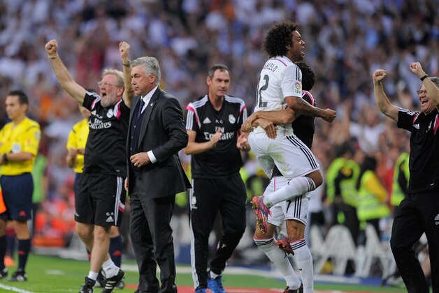 MADRID, SPAIN - OCTOBER 25:  Marcelo of Real Madrid CF celebrates after Karim Benzema scored Real's 3rd goal during the La Liga match between Real Madrid CF and FC Barcelona at Estadio Santiago Bernabeu on October 25, 2014 in Madrid, Spain.  (Photo by Denis Doyle/Getty Images)