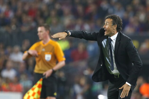 Barcelona’s head coach Luis Enrique gives instruction toward his players during the Champions League group F soccer match between F.C. Barcelona and Ajax at Camp Nou stadium in Barcelona, Spain, Tuesday, Oct. 21, 2014. (AP Photo/Emilio Morenatti)