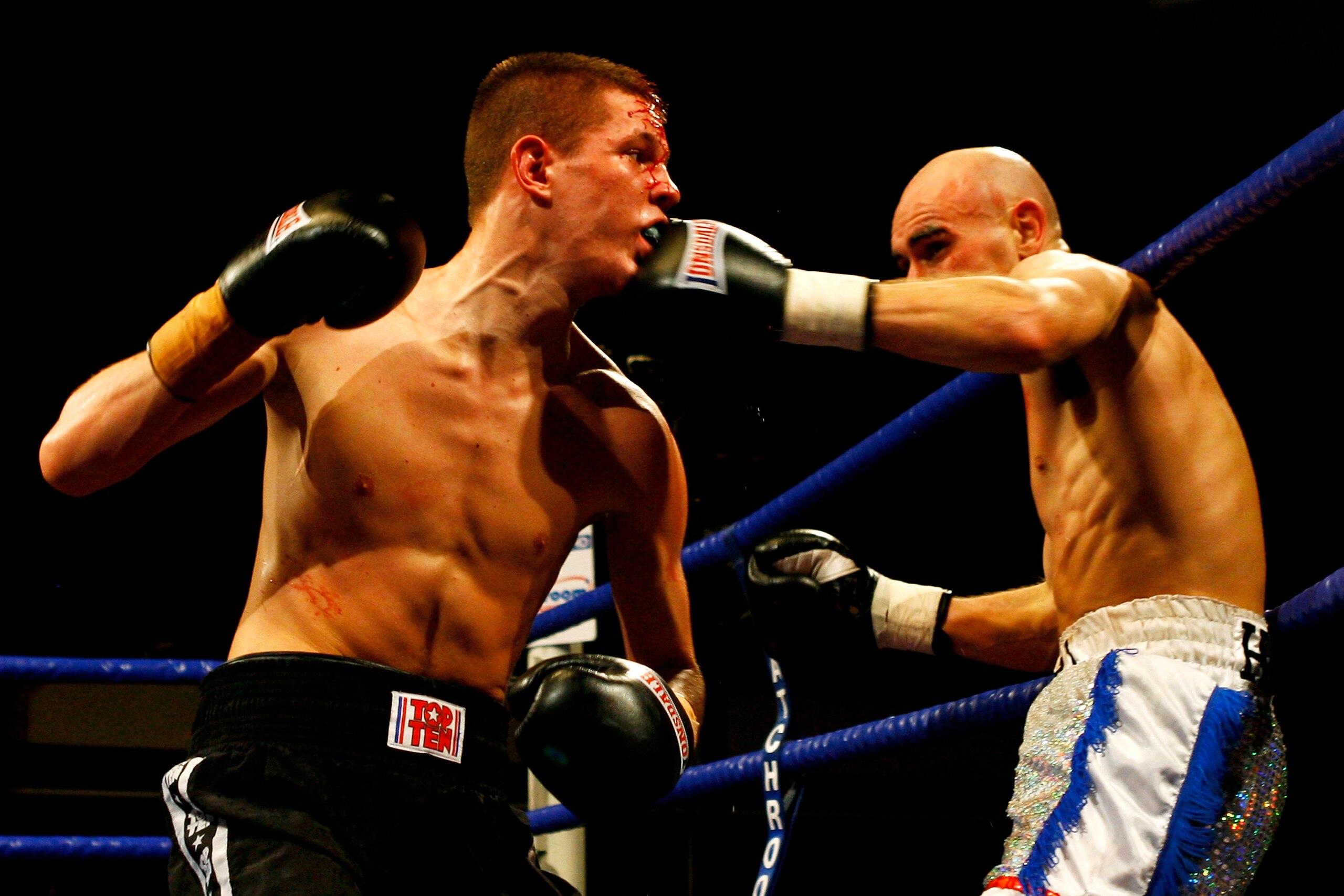 LONDON, ENGLAND - FEBRUARY 12:  Stuart Hall (R) lands a punch on Richard Szelebedi in their bout at York Hall on February 12, 2010 in London, England.  (Photo by Dean Mouhtaropoulos/Getty Images)