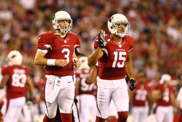 Aug. 24, 2013; Glendale, AZ, USA: Arizona Cardinals quarterback Carson Palmer (3) and wide receiver Michael Floyd (15) against the San Diego Chargers during a preseason game at University of Phoenix Stadium. Mandatory Credit: Mark J. Rebilas-USA TODAY Sports