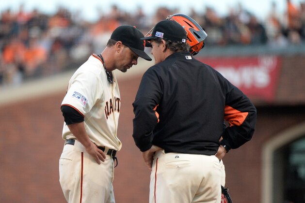 SAN FRANCISCO, CA - OCTOBER 15:  Ryan Vogelsong #32 of the San Francisco Giants talks with pitching coach Dave Righetti in the third inning against the St. Louis Cardinals during Game Four of the National League Championship Series at AT&T Park on October 15, 2014 in San Francisco, California.  (Photo by Harry How/Getty Images)