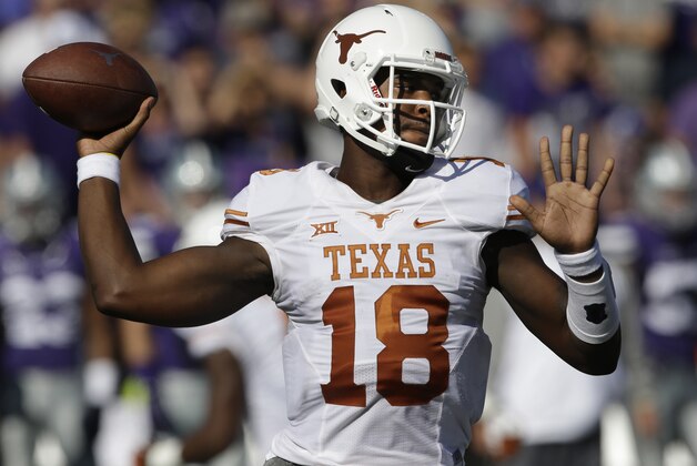 Texas quarterback Tyrone Swoopes (18) throws a pass during the first half of an NCAA college football game against Kansas State in Manhattan, Kan., Saturday, Oct. 25, 2014. (AP Photo/Orlin Wagner)