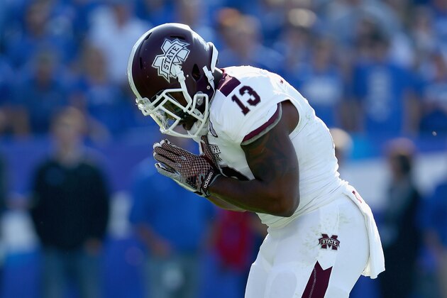 LEXINGTON, KY - OCTOBER 25:  Josh Robinson #13 of the Mississippi State Bulldogs celebrates after running for a touchdown during the game against the Kentucky Wildcats at Commonwealth Stadium on October 25, 2014 in Lexington, Kentucky.  (Photo by Andy Lyons/Getty Images)