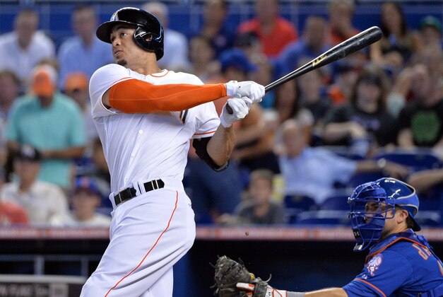 Sep 1, 2014; Miami, FL, USA; Miami Marlins right fielder Giancarlo Stanton (27) connects for a solo home run during the first inning against the New York Mets at Marlins Ballpark. Mandatory Credit: Steve Mitchell-USA TODAY Sports