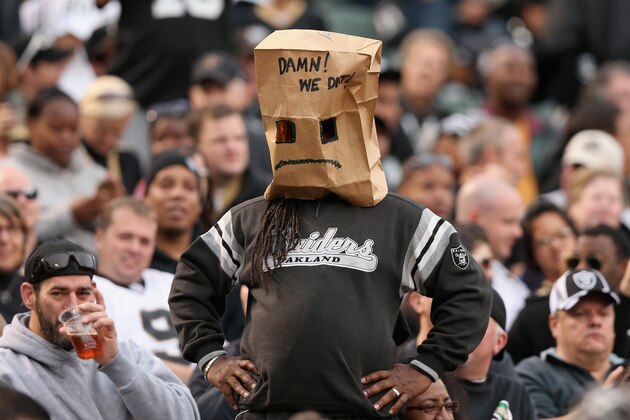 OAKLAND, CA - NOVEMBER 18: An Oakland Raiders fan covers his head with a paper bag during their loss to the New Orleans Saints at O.co Coliseum on November 18, 2012 in Oakland, California.  (Photo by Ezra Shaw/Getty Images)