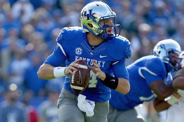 LEXINGTON, KY - OCTOBER 25:  Patrick Towles #14 of the Kentucky Wildcats runs with the ball during the game against the Mississippi State Bulldogs at Commonwealth Stadium on October 25, 2014 in Lexington, Kentucky.  (Photo by Andy Lyons/Getty Images)