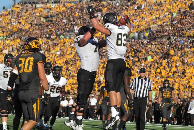 COLUMBIA , MO - OCTOBER 25:  Nathan Marcus #83 of the Vanderbilt Commodores celebrates his touchdown with Spencer Pulley #77 in the second quarter during a game against the Missouri Tigers at Memorial Stadium on October 25, 2014 in Columbia, Missouri.  (Photo by Ed Zurga/Getty Images)