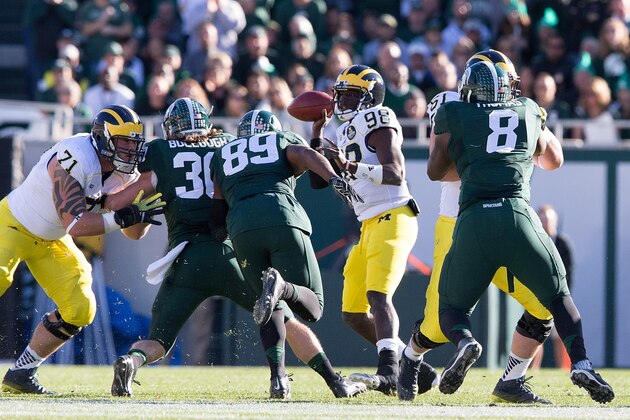 EAST LANSING, MI - OCTOBER 25:  T.J. Harrell #31 of the Michigan State Spartans and teammate Shilique Calhoun #89 of the rush quarterback  Devin Gardner #98 of the Michigan Wolverines during the first quarter of the game at Spartan Stadium on October 25 , 2014 in East Lansing, Michigan. (Photo by Leon Halip/Getty Images)
