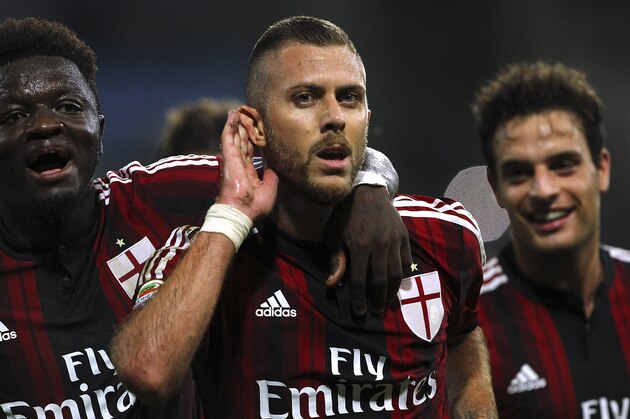 PARMA, ITALY - SEPTEMBER 14:  Jeremy Menez (C) of AC Milan celebrates his goal with his team-mate Sulley Ali Muntari (L)during the Serie A match between Parma FC and AC Milan at Stadio Ennio Tardini on September 14, 2014 in Parma, Italy.  (Photo by Marco Luzzani/Getty Images)