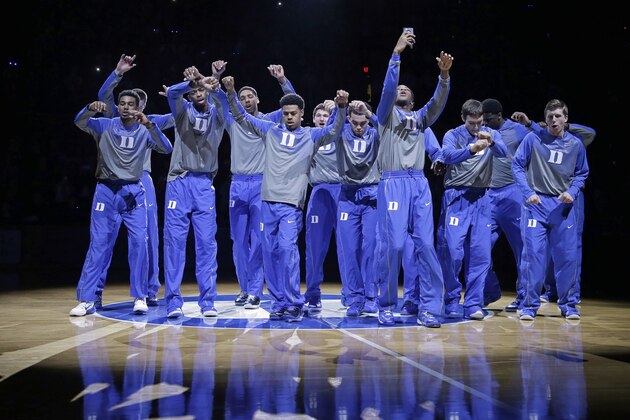 Duke's basketball team is introduced during Countdown to Craziness as the team kicks off its NCAA college basketball season at Cameron Indoor Stadium in Durham, N.C., Saturday, Oct. 25, 2014. (AP Photo/Gerry Broome)