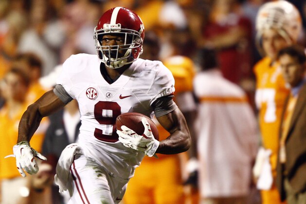 Alabama wide receiver Amari Cooper (9) runs for a touchdown in the first quarter of an NCAA college football game against Tennessee, Saturday, Oct. 25, 2014, in Knoxville, Tenn. (AP Photo/Wade Payne)