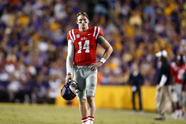 Mississippi quarterback Bo Wallace (14) stands on the field during a stop in action in the first half of an NCAA college football game in Baton Rouge, La., Saturday, Oct. 25, 2014. (AP Photo/Jonathan Bachman)