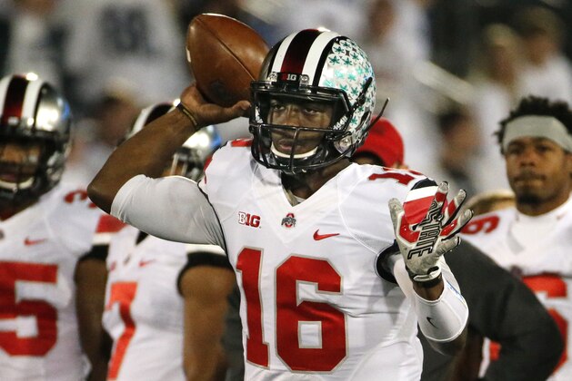 Ohio State quarterback J.T. Barrett (16) warms up before an NCAA college football game against Penn State in State College, Pa., Saturday, Oct. 25, 2014. (AP Photo/Gene J. Puskar)