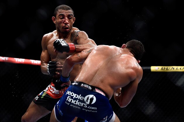 RIO DE JANEIRO, BRAZIL - OCTOBER 25: Chad Mendes of the United States punches Jose Aldo of Brazil in their featherweight championship bout during the UFC 179 event at Maracanazinho on October 25, 2014 in Rio de Janeiro, Brazil. (Photo by Buda Mendes/Getty Images)