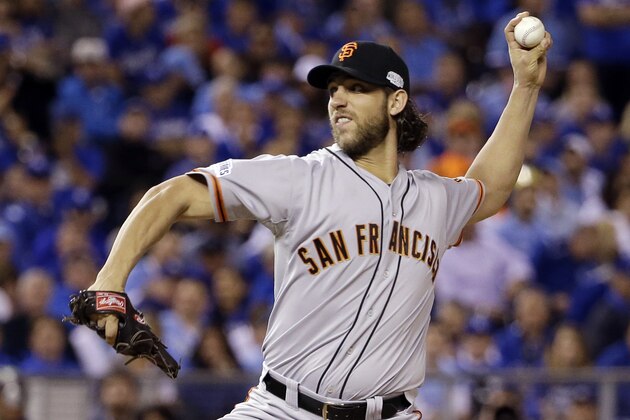 San Francisco Giants pitcher Madison Bumgarner throws during the first inning of Game 1 of baseball's World Series against the Kansas City Royals Tuesday, Oct. 21, 2014, in Kansas City, Mo. (AP Photo/David J. Phillip)