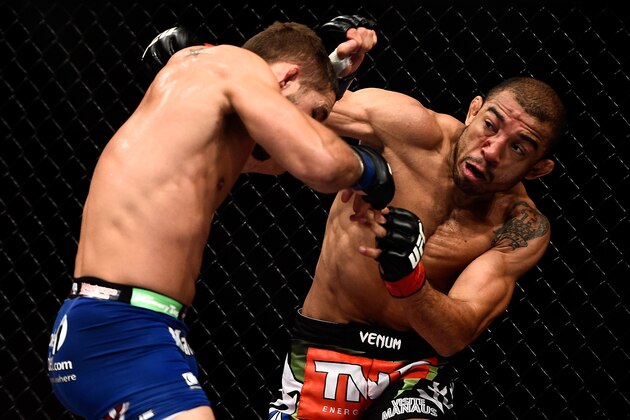 RIO DE JANEIRO, BRAZIL - OCTOBER 25: Jose Aldo of Brazil punches Chad Mendes of the United States in their featherweight championship bout during the UFC 179 event at Maracanazinho on October 25, 2014 in Rio de Janeiro, Brazil. (Photo by Buda Mendes/Getty Images)