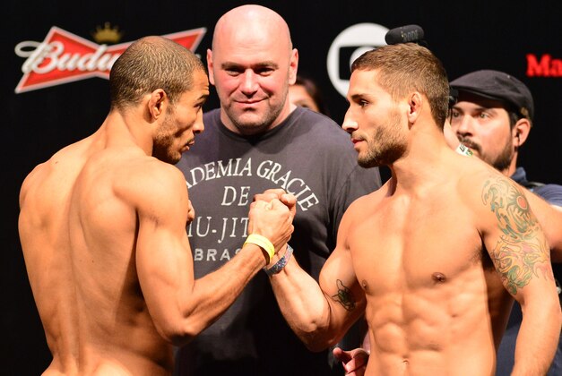 Oct 24, 2014; Rio de Janeiro, BRAZIL; Jose Aldo (left) and Chad Mendes during weigh-ins for UFC 179 at Ginasio do Maracanazinho. Mandatory Credit: Jason Silva-USA TODAY Sports