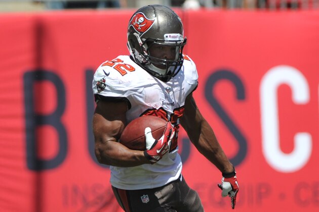 TAMPA, FL - SEPTEMBER 29: Running back Doug Martin #22 of the Tampa Bay Buccaneers rushes upfield against the Arizona Cardinals September 29, 2013 at Raymond James Stadium in Tampa, Florida. (Photo by Al Messerschmidt/Getty Images)