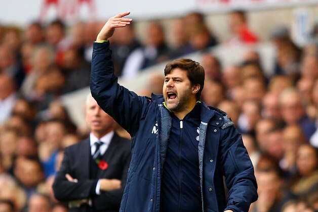 LONDON, ENGLAND - OCTOBER 26:  Mauricio Pochettino, manager of Spurs gestures next to Alan Pardew, manager of Newcastle United during the Barclays Premier League match between Tottenham Hotspur and Newcastle United at White Hart Lane on October 26, 2014 in London, England.  (Photo by Richard Heathcote/Getty Images)
