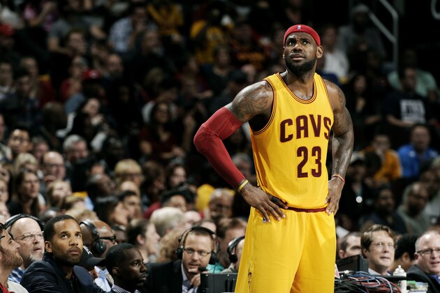 CLEVELAND, OH - OCTOBER 17:  LeBron James #23 of the Cleveland Cavaliers looks up at the scoreboard during a break in the action against the Dallas Mavericks at The Quicken Loans Arena on October 17, 2014 in Cleveland, Ohio. NOTE TO USER: User expressly acknowledges and agrees that, by downloading and/or using this Photograph, user is consenting to the terms and conditions of the Getty Images License Agreement. Mandatory Copyright Notice: Copyright 2014 NBAE (Photo by David Liam Kyle/NBAE via Getty Images)