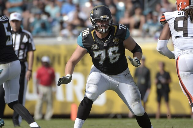 Jacksonville Jaguars tackle Luke Joeckel (76) sets up to block against Cleveland Browns outside linebacker Jabaal Sheard (97) during the second half of an NFL football game in Jacksonville, Fla., Sunday, Oct. 19, 2014.(AP Photo/Phelan M. Ebenhack)