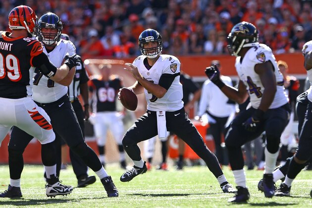 CINCINNATI, OH - OCTOBER 26 :  Joe Flacco #5 of the Baltimore Ravens drops back to throw a pass during the first quarter of the game against the Cincinnati Bengals at Paul Brown Stadium on October 26, 2014 in Cincinnati, Ohio. (Photo by Andy Lyons/Getty Images)