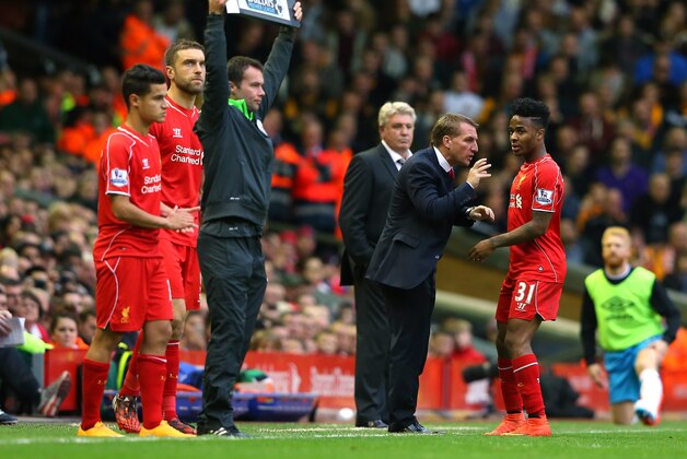 LIVERPOOL, ENGLAND - OCTOBER 25:  Brendan Rodgers the manager of Liverpool talks with Raheem Sterling during the Barclays Premier League match between Liverpool and Hull City at Anfield on October 25, 2014 in Liverpool, England.  (Photo by Alex Livesey/Getty Images)