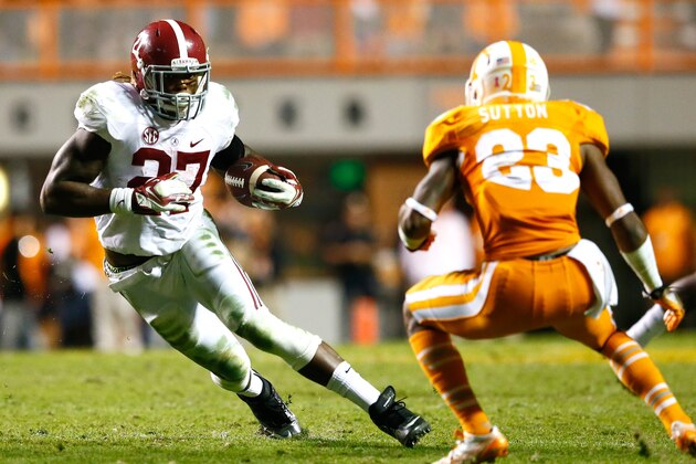 KNOXVILLE, TN - OCTOBER 25:  Derrick Henry #27 of the Alabama Crimson Tide rushes against Cameron Sutton #23 of the Tennessee Volunteers at Neyland Stadium on October 25, 2014 in Knoxville, Tennessee.  (Photo by Kevin C. Cox/Getty Images)