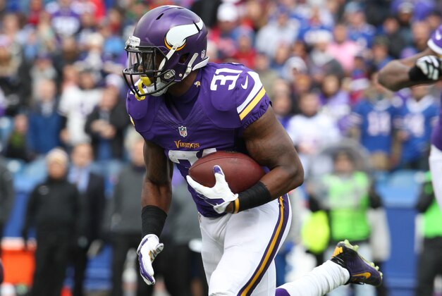 Oct 19, 2014; Orchard Park, NY, USA; Minnesota Vikings running back Jerick McKinnon (31) runs the ball during the first quarter against the Buffalo Bills at Ralph Wilson Stadium. Mandatory Credit: Timothy T. Ludwig-USA TODAY Sports
