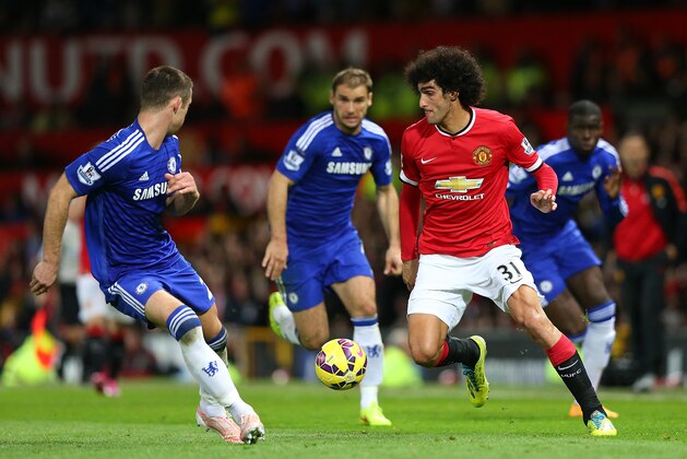 MANCHESTER, ENGLAND - OCTOBER 26:  Marouane Fellaini of Manchester United competes with Gary Cahill of Chelsea during the Barclays Premier League match between Manchester United and Chelsea at Old Trafford on October 26, 2014 in Manchester, England.  (Photo by Alex Livesey/Getty Images)