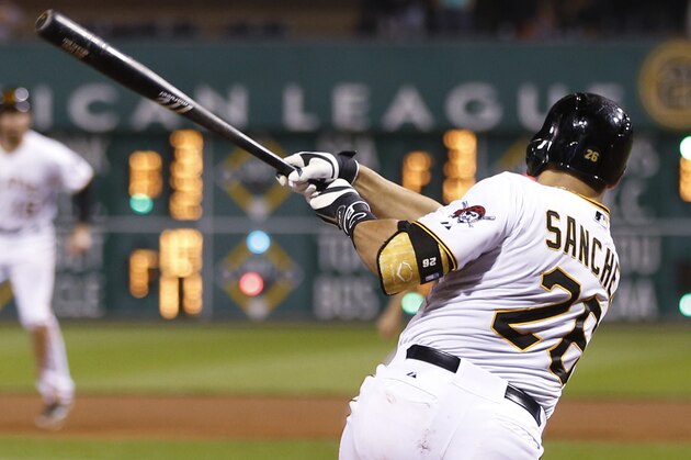 Pittsburgh Pirates' Tony Sanchez hits a single against the Baltimore Orioles to drive in Starling Marte with the go-ahead run in the seventh inning of a baseball game Wednesday, May 21, 2014, in Pittsburgh. The Pirates won 9-8. (AP Photo/Keith Srakocic)