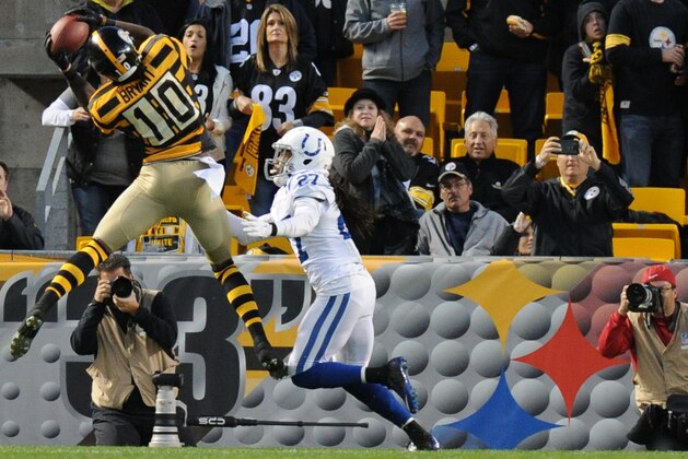 Pittsburgh Steelers wide receiver Martavis Bryant (10) makes a touchdown catch over Indianapolis Colts free safety Josh Gordy (27)in the third quarter of the NFL football game, Sunday, Oct. 26, 2014 in Pittsburgh. (AP Photo/Don Wright)