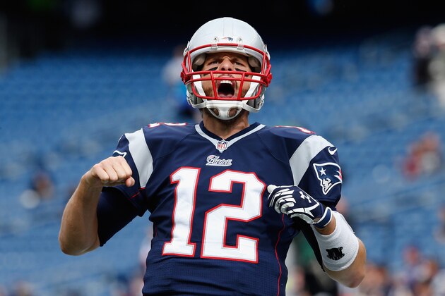 FOXBORO, MA - OCTOBER 26:  Tom Brady #12 of the New England Patriots reacts before a game against the Chicago Bears at Gillette Stadium on October 26, 2014 in Foxboro, Massachusetts.  (Photo by Jim Rogash/Getty Images)