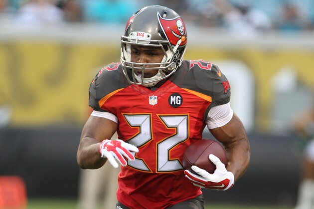 Running back Doug Martin #22 of the Tampa Bay Buccaneers runs the ball during a Pre-Season NFL football game against the Jacksonville Jaguars, Friday, Aug. 8, 2014, in Jacksonville, Fla. (Photo by Marc Serota/Panini/AP Images)