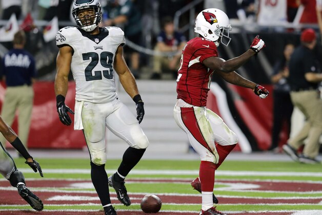 Arizona Cardinals wide receiver John Brown (12) celebrates his touchdown as Philadelphia Eagles strong safety Nate Allen (29) walks away during the second half of an NFL football game, Sunday, Oct. 26, 2014, in Glendale, Ariz. (AP Photo/Rick Scuteri)