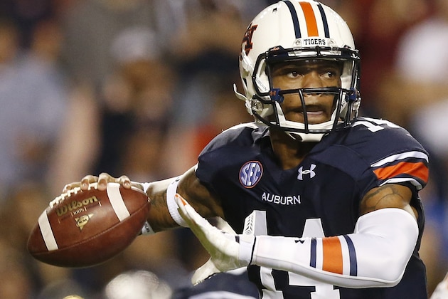 Auburn quarterback Nick Marshall (14) sets back to throw the ball against South Carolina during the second half of an NCAA college football game Saturday, Oct. 25, 2014, in Auburn, Ala. Auburn won 42-35. (AP Photo/Brynn Anderson)
