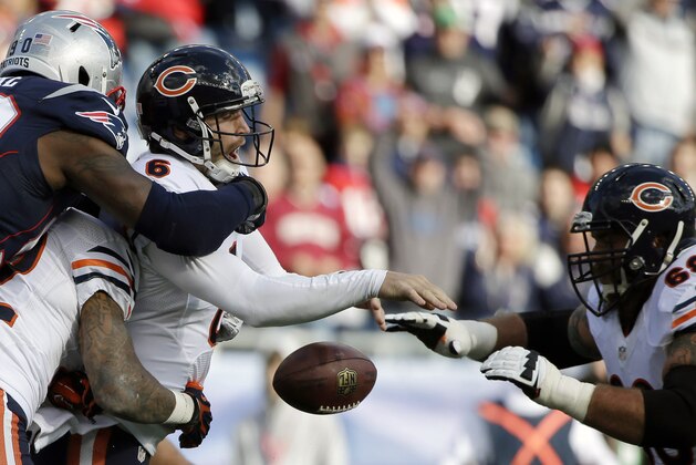 New England Patriots defensive end Zach Moore (90) forces Chicago Bears quarterback Jay Cutler (6) to fumble in the first half of an NFL football game on Sunday, Oct. 26, 2014, in Foxborough, Mass. (AP Photo/Steven Senne)