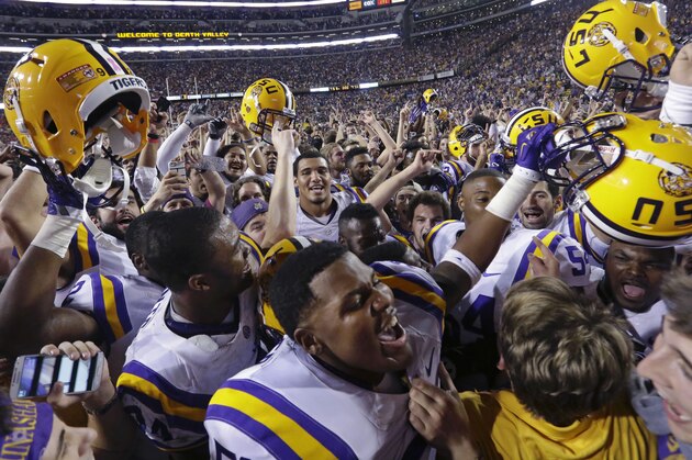 LSU celebrates its victory over Mississippi after their NCAA college football game in Baton Rouge, La., Saturday, Oct. 25, 2014. LSU won 10-7. (AP Photo/Gerald Herbert)